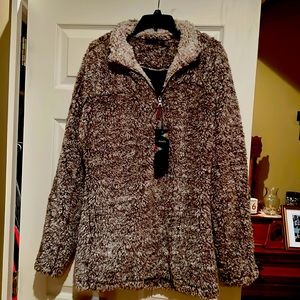 Brown and white Sherpa pullover. Never been worn. Lined on the inside.